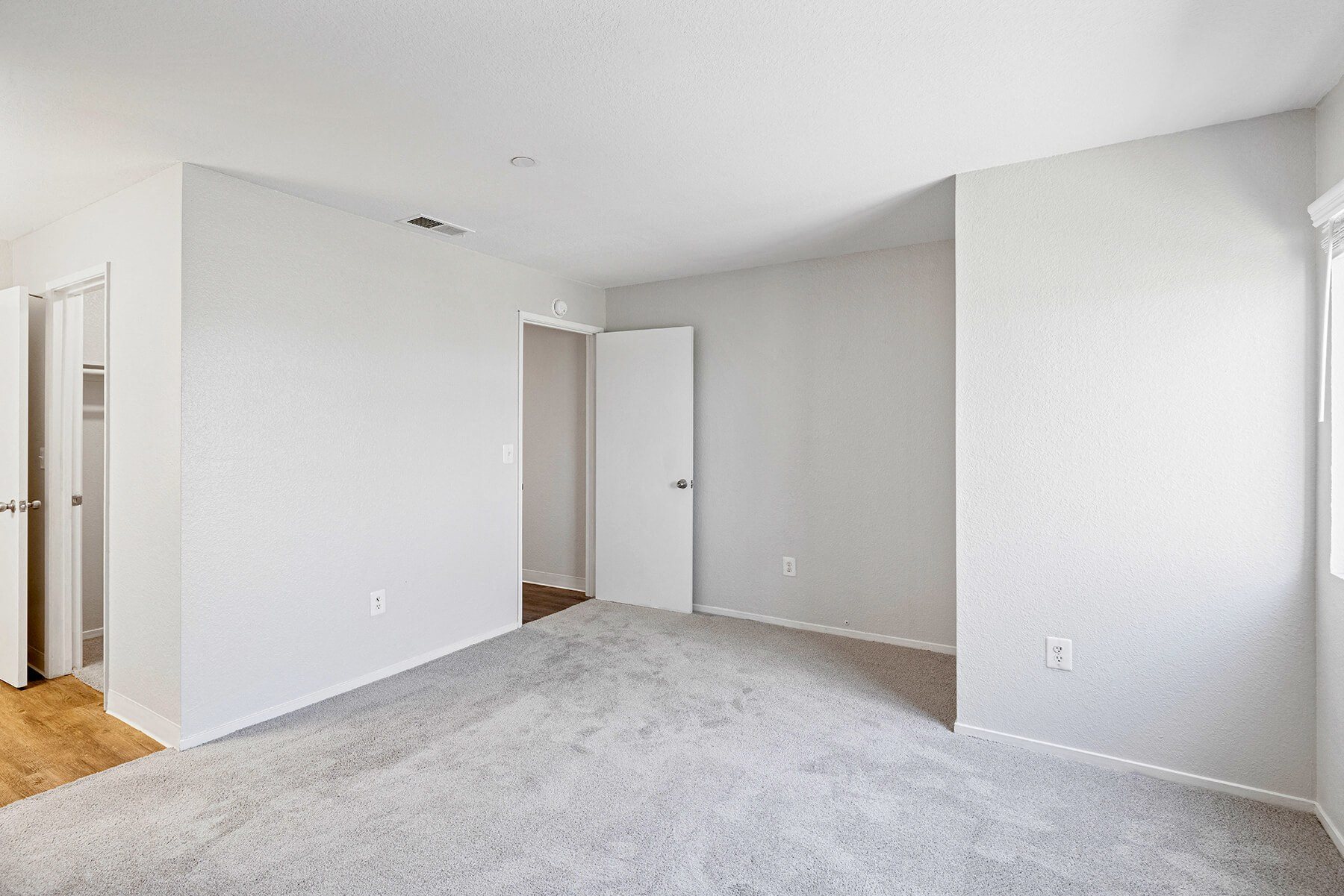 Carpeted bedroom at Hilltop Commons Apartments in San Pablo CA